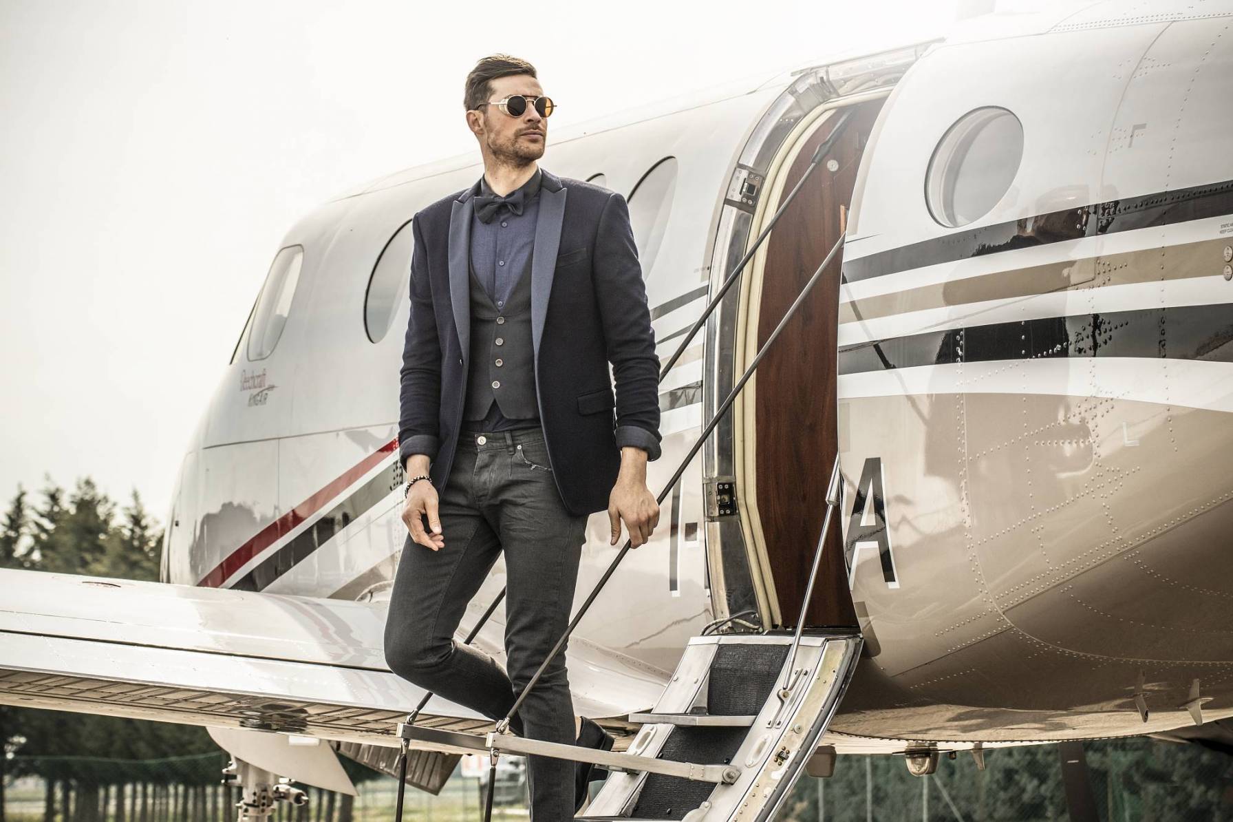 Businessman boarding private jet