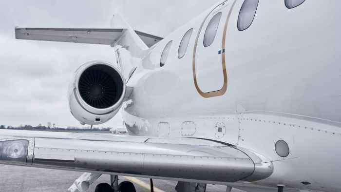 private-jet-engine-and-wing-closeup-on-tarmac