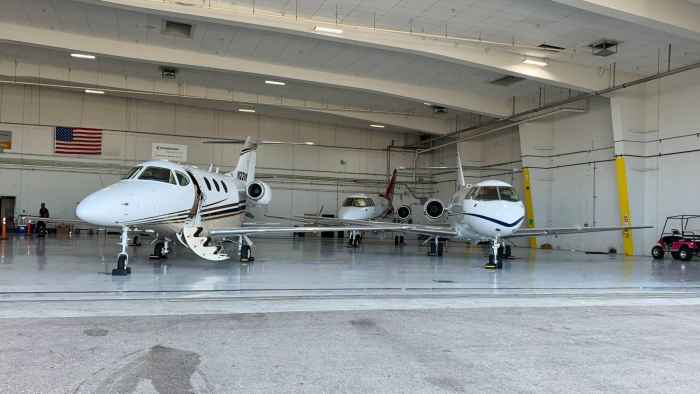 private-jets-inside-aircraft-hangar-ready-for-flight