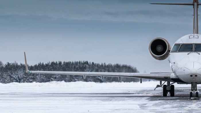 front-view-executive-airplane-winter-airport-apron
