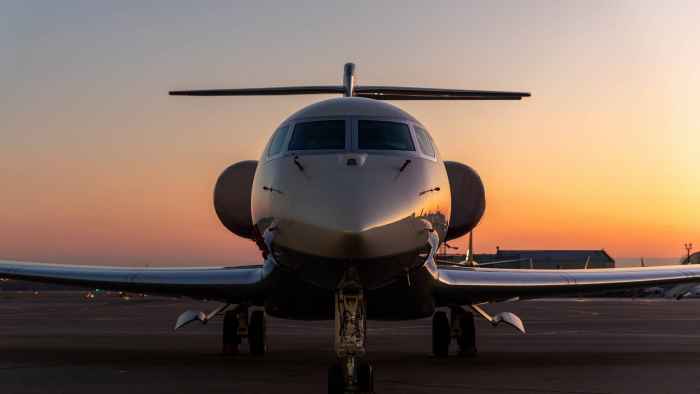 private-jet-on-runway-at-sunset