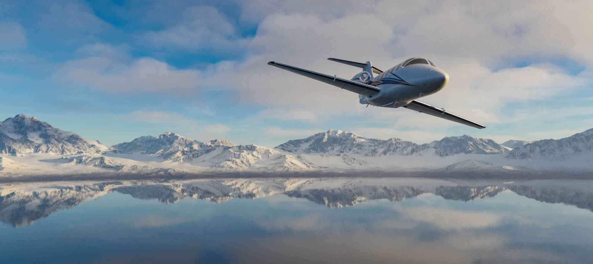 corporate-jet-flying-over-mountain-reflecting (1)