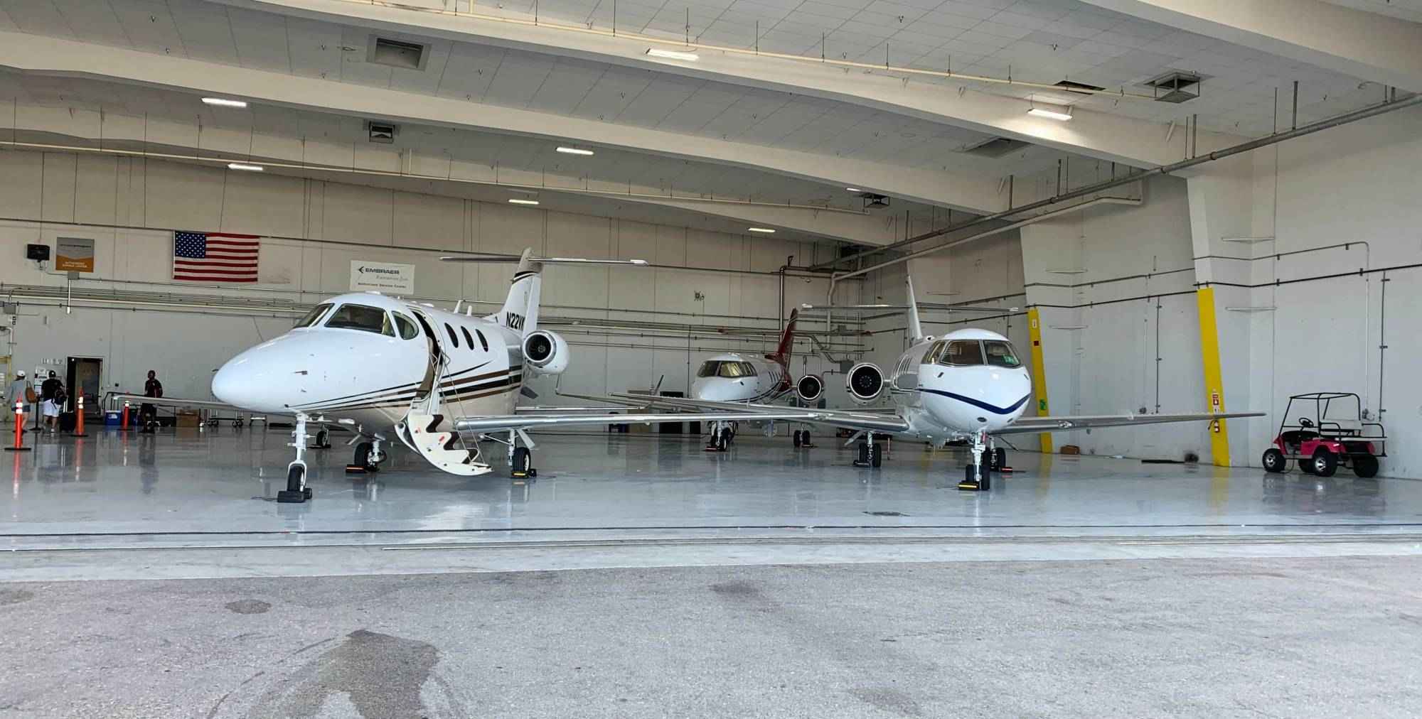 private-jets-inside-aircraft-hangar-ready-for-flight