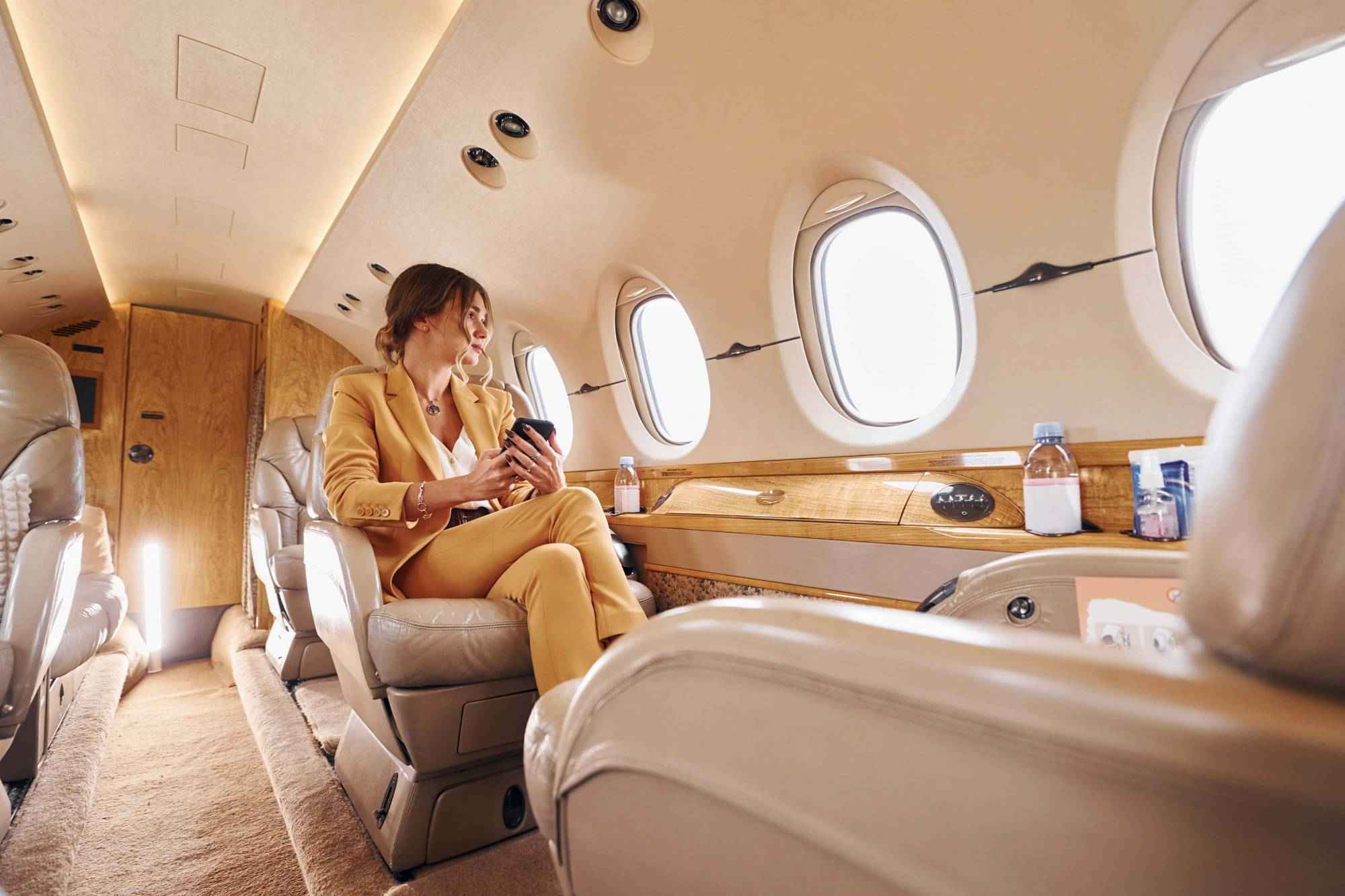woman-relaxing-in-first-class-private-plane-cabin