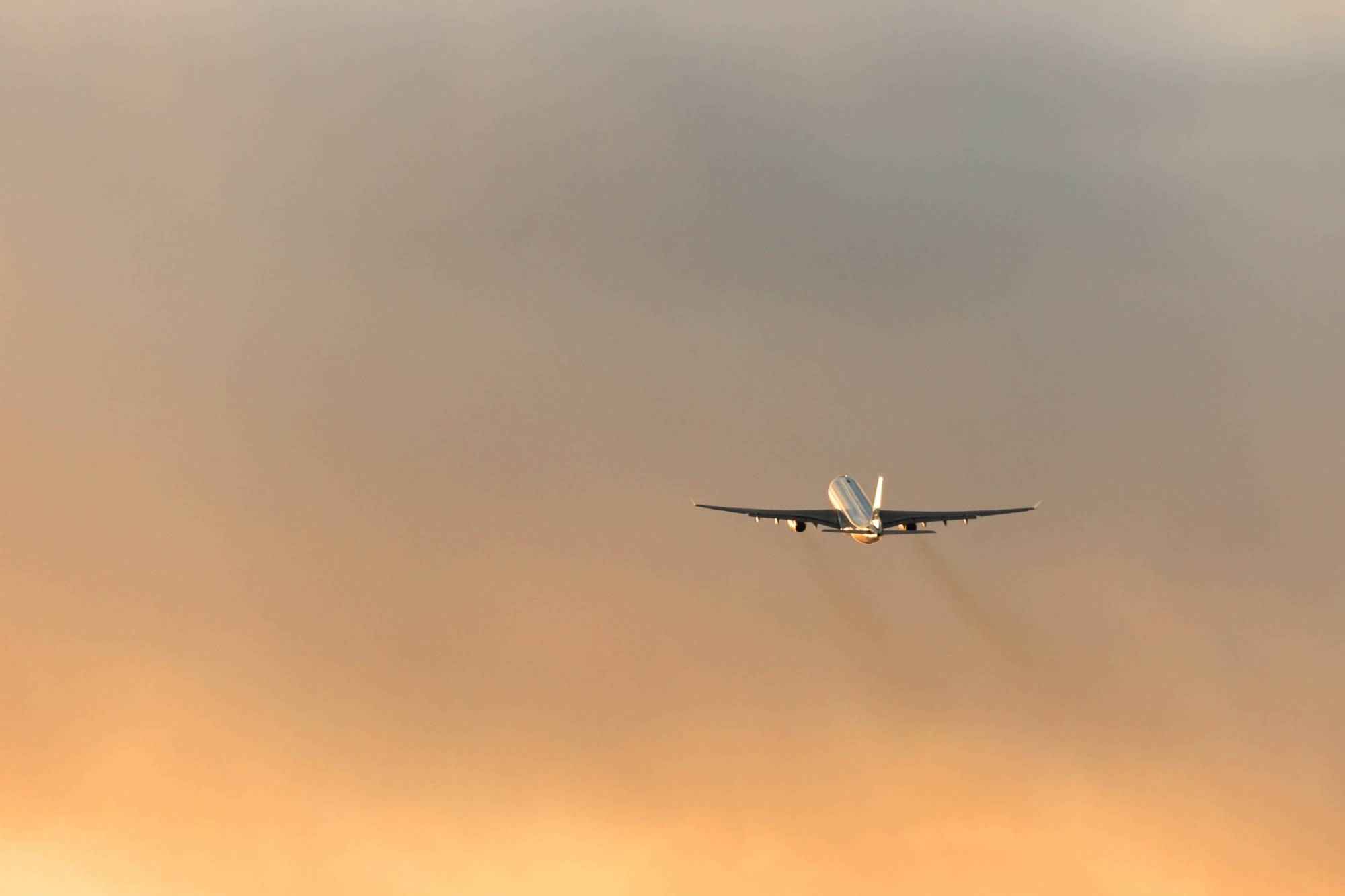 airplane-taking-off-against-a-golden-sky