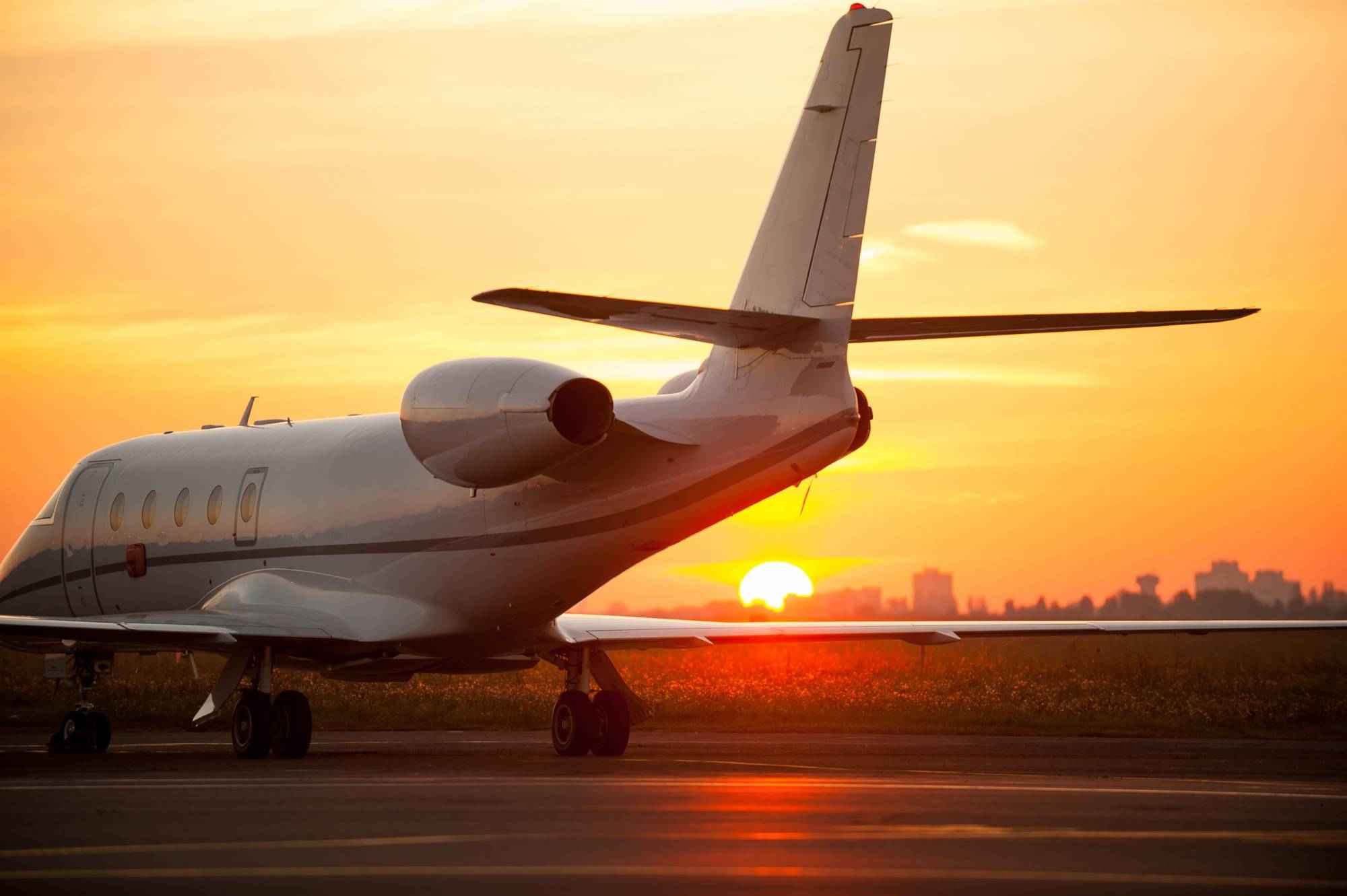 private-airplane-at-sunset-on-the-runway