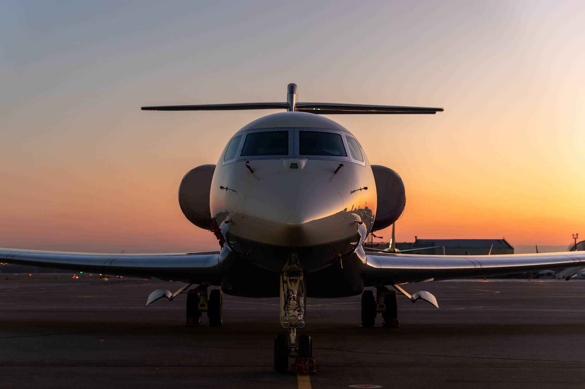 private-jet-on-runway-at-sunset