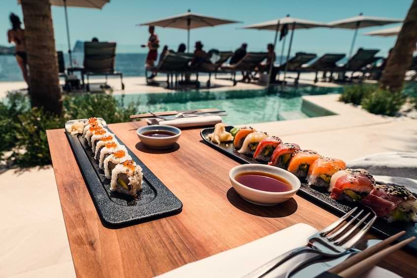 view of a beach of Ibiza and some sushi