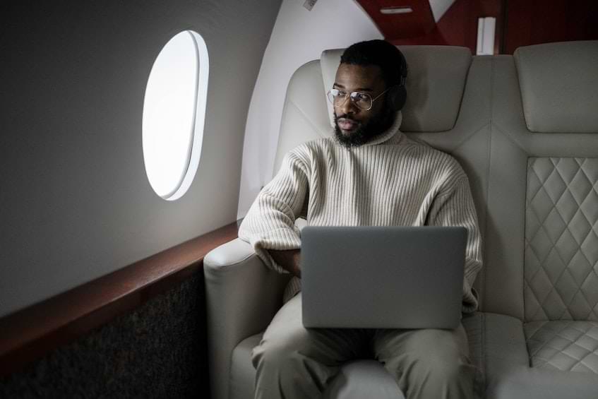Young man travelling by private jet