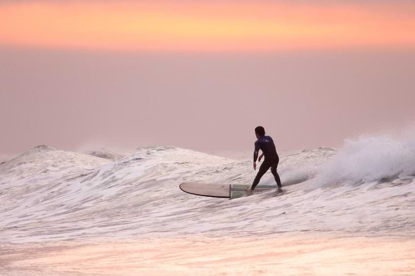 Guy surfing, Hawaii